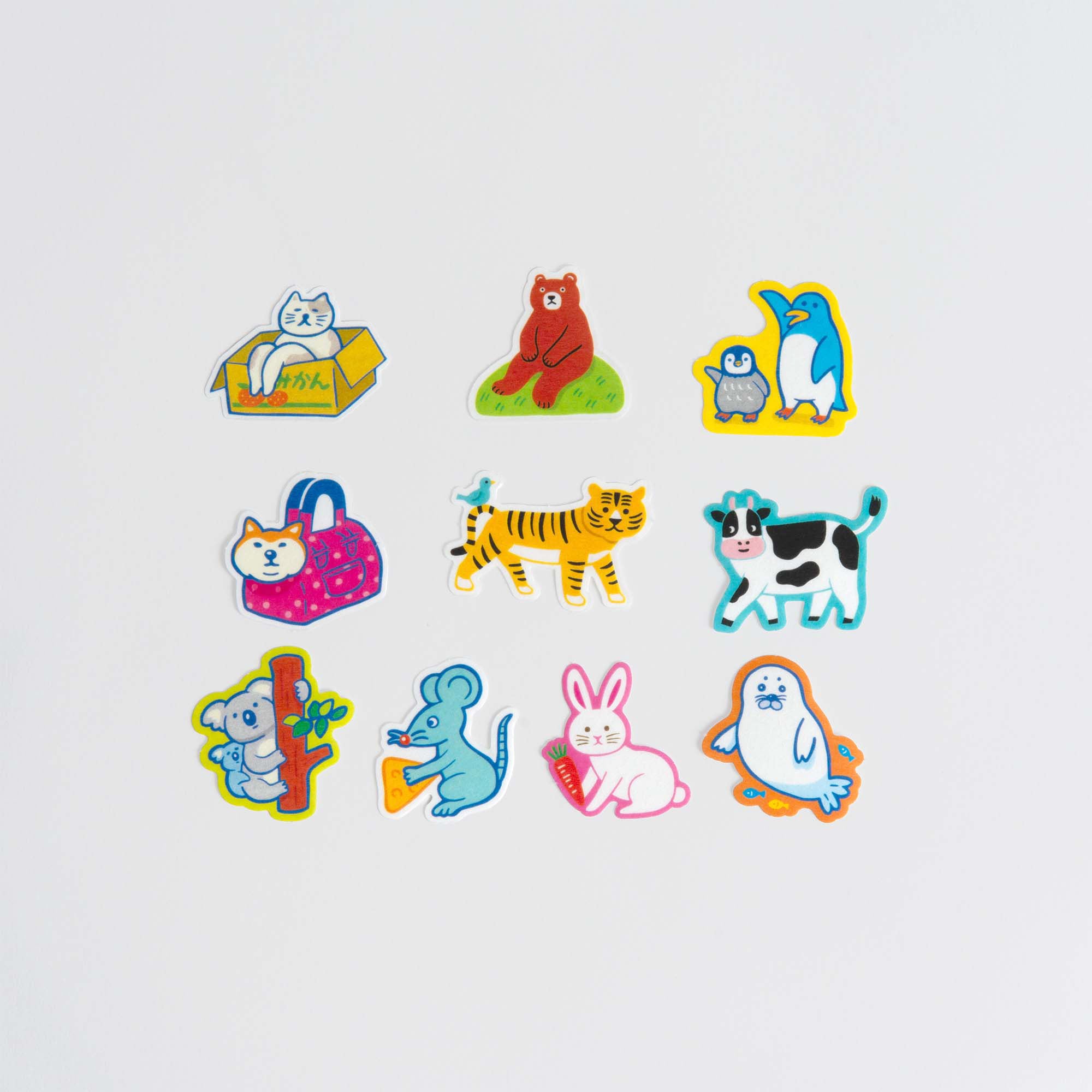Das Hightide Flake Sticker Set von Hightide enthält 12 farbenfrohe Cartoon-Tiersticker wie eine Katze in einer Box, einen Bären, eine Kuh, einen Tiger und einen Pinguin - mit liebenswerten Laidback Animals auf einem schlichten weißen Hintergrund.