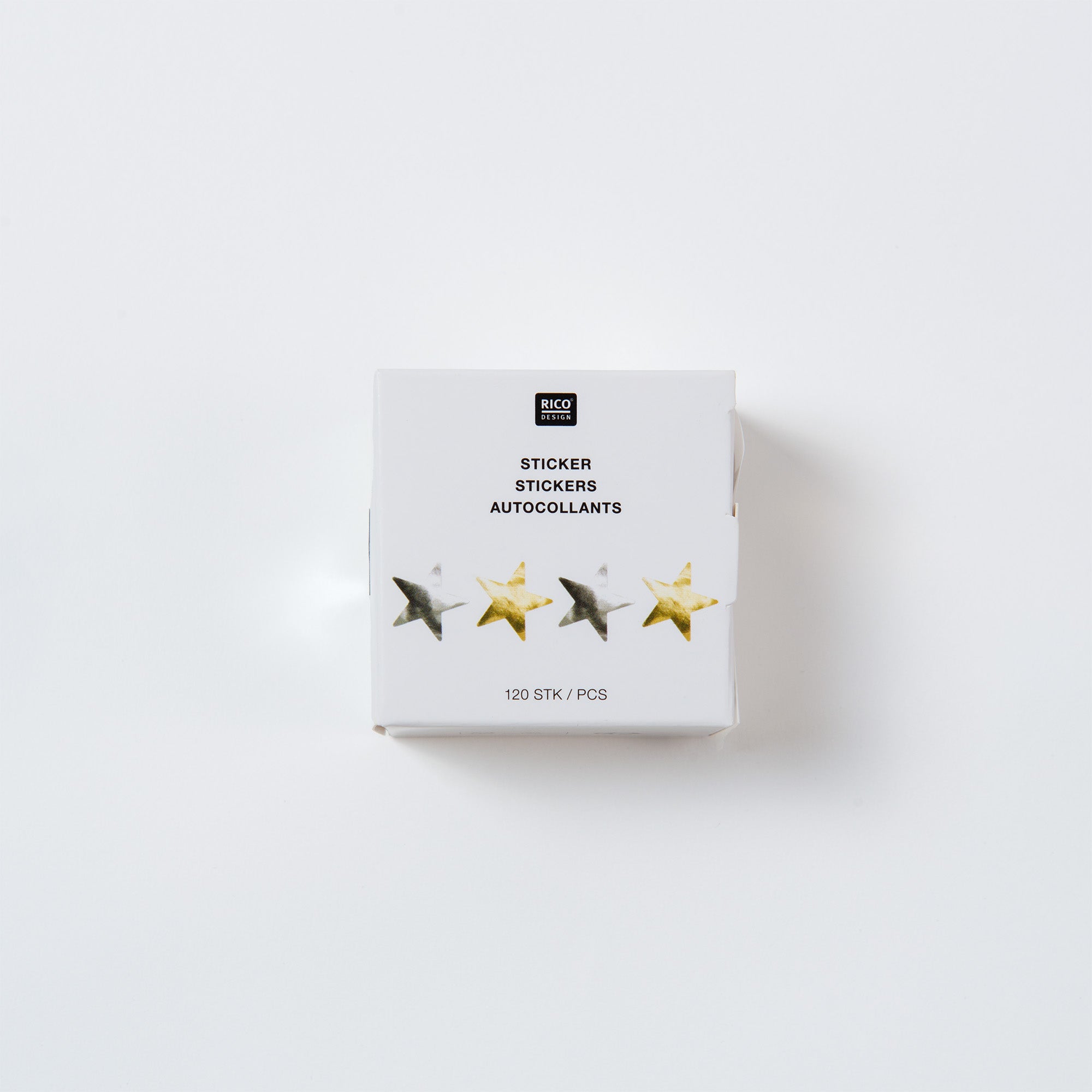 Eine weiße Packung sternförmiger Aufkleber aus der „Sterne“-Kollektion von Paper Poetry ist auf einem hellen Hintergrund abgebildet, perfekt für Weihnachten. Sie zeigt schillernde goldene und silberne Sterne und trägt den Text „Sticker Stickers Autocollants“ mit „120 STK/PCS“ an der Unterseite.