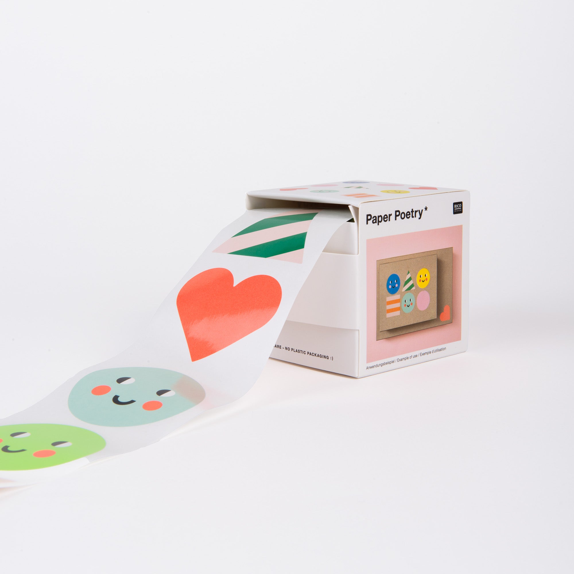 Ein Sticker-Set – 7 Mal Fröhlichkeit von Paper Poetry ist teilweise aus seiner weißen Box ausgerollt und zeigt fröhliche Designs wie Smileys und lebendige Formen mit einem großen roten Herzen und grünen Streifen, ideal, um Freude in jede „Happy Birthday“-Feier zu bringen.