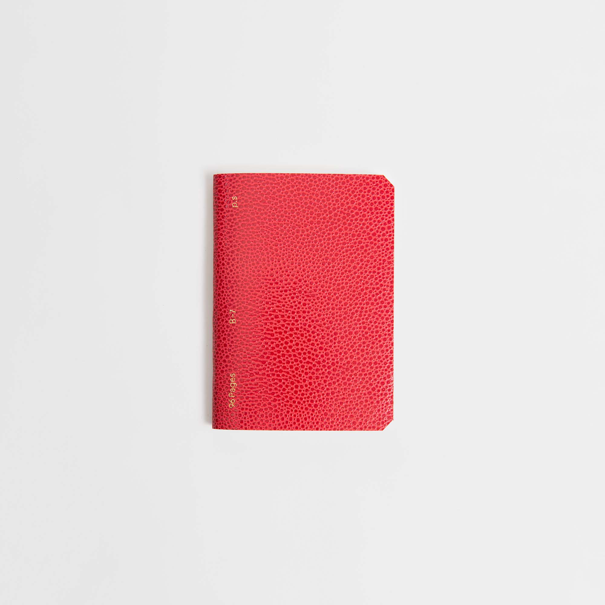 Der B96 Red Lipstick von paperlux.store zeichnet sich durch ein elegantes, strukturiertes rotes Gehäuse mit goldenen Details aus, das vor einem klaren weißen Hintergrund steht.