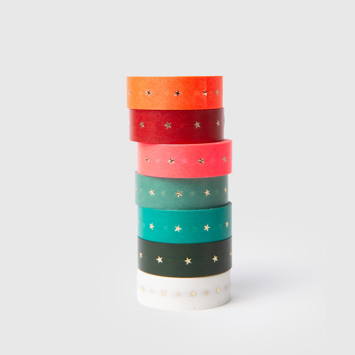 Ein vertikaler Stapel aus sieben Paper Poetry Washi Tape Set – XXL Sterne in verschiedenen Farben, jeweils mit kleinen goldenen Sternen verziert.